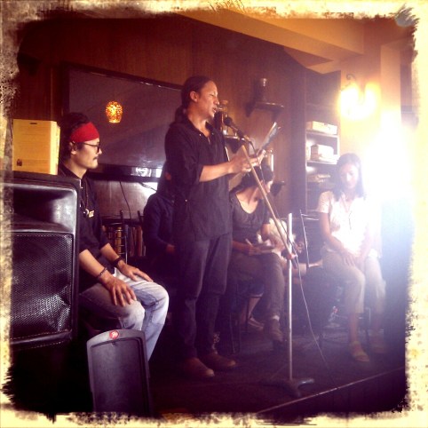 Bhuchung reading from Yak Horns